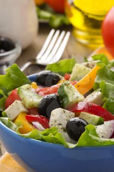 greek salad on wood background