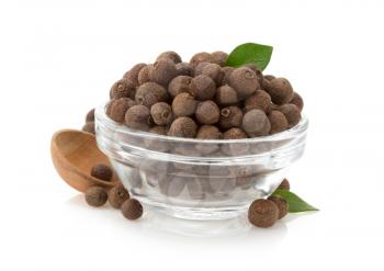 allspice in bowl isolated on white background