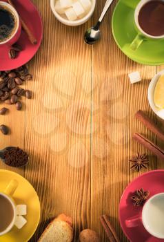 cup of tea, milk, coffee on wooden background