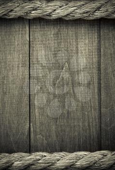 ship ropes on wooden background