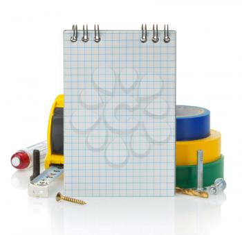 notebook and tools isolated on white background