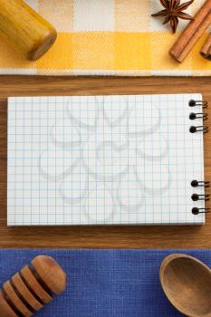notebook for cooking recipes on wooden table