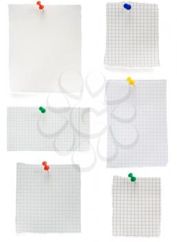pushpin and  checked note paper isolated on white background