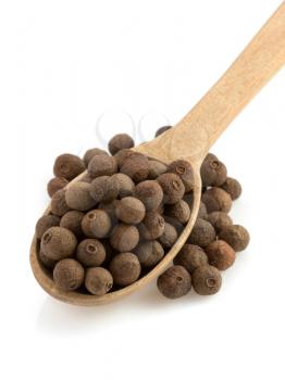 allspice in spoon isolated on white background