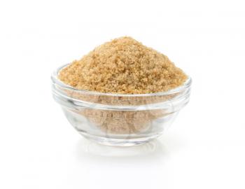 brown sugar in bowl isolated on white background