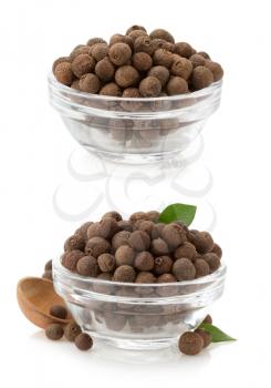 allspice in bowl isolated on white background