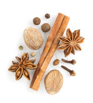 cinnamon sticks, anise star and nutmeg on white background
