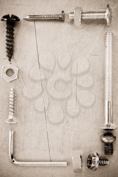 bolts and nuts tool at metal background texture