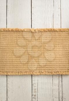 burlap hessian sack on wooden background