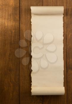 parchment scroll on wooden background