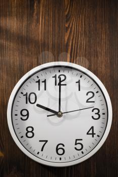 wall clock on wooden background