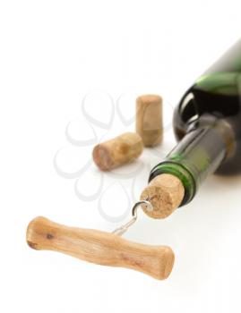 corkscrew and wine bottle isolated on white background