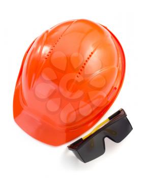 construction helmet and safety glasses on white background