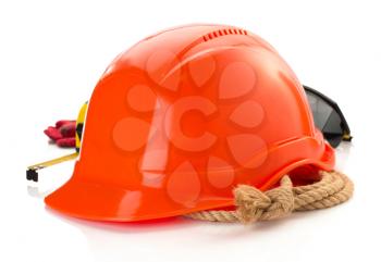 construction helmet and safety glasses on white background