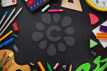 school supplies on wooden background