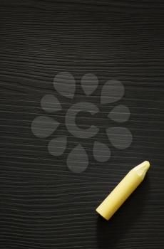 yellow chalk on wooden texture