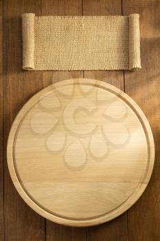 sack burlap and cutting board on wooden background