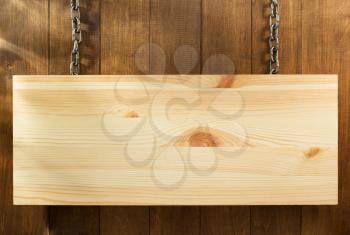 hanging signboard board on wooden background
