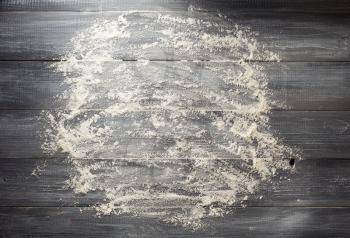 flour powder on wood background