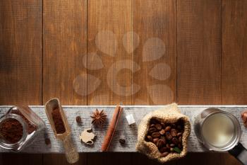 coffee ingredients on wooden background