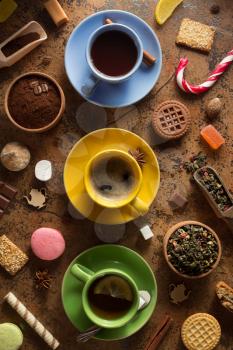 cup of coffee, tea and cacao at abstract background