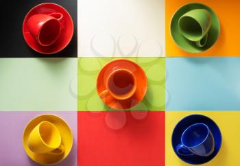 empty coffee cup and plate at abstract colorful background