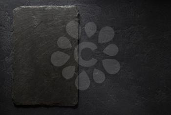 slate signboard at black background  texture