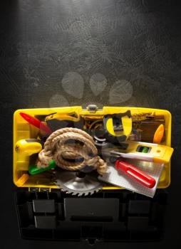 tools and instruments with toolbox  on black background