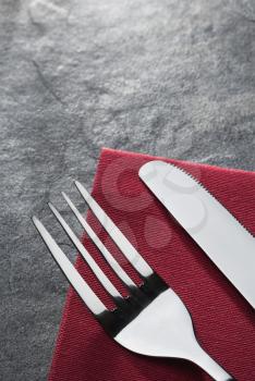 knife and fork on napkin cloth