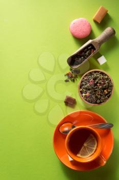 cup of tea at green surface background