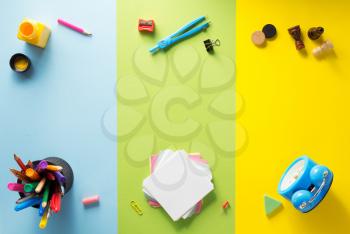 school supplies at abstract colorful background texture