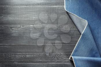 blue jeans texture on wooden background