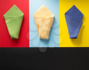 folded napkin at abstract colorful background