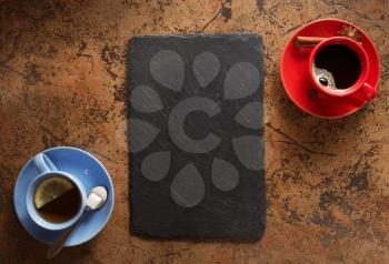 cup of coffee and tea at abstract stone background