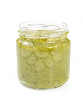 pesto sauce in jar isolated on white background