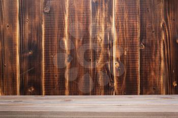 wooden plank shelf at wall background