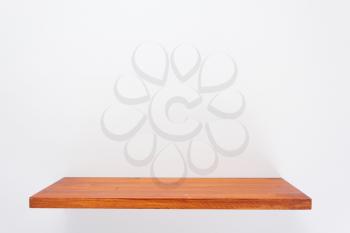 wooden shelf at white background texture wall