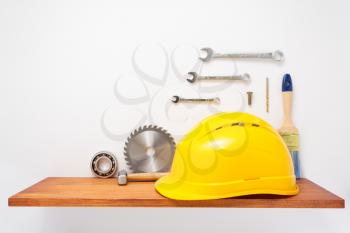 set of  tools and instruments on shelf at white background