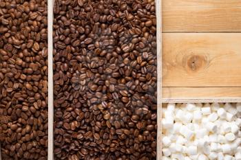 coffee beans in wooden plank box background, top view