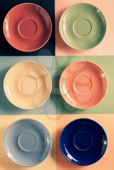 empty saucer at abstract colorful background