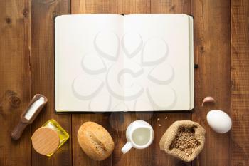 bakery ingredients on wooden background table, top view
