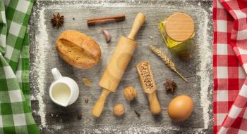 bakery ingredients on wooden background, top view