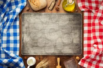 bread and bakery ingredients on wooden table background, top view