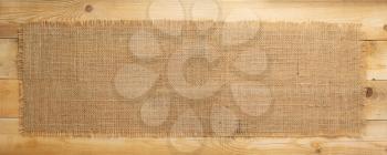 burlap hessian sacking on wooden plank board background