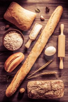 bread and bakery products on wood background