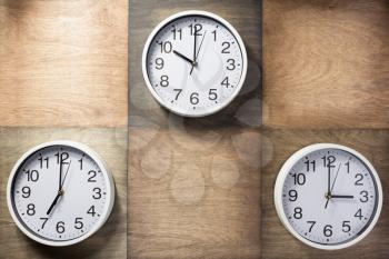 wall clock at wooden background surface