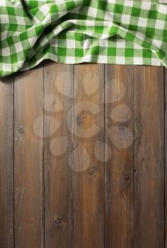 checkered napkin cloth on wooden background