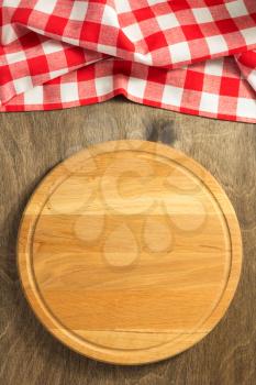 pizza cutting board at wooden background