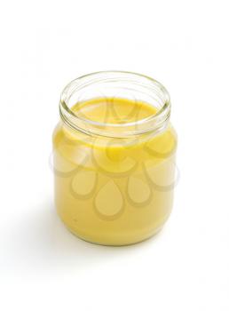 mustard sauce in jar isolated on white background