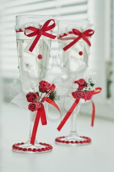 Decorated red glasses for champagne.